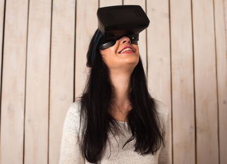 Woman in virtual reality helmet. VR glasses.