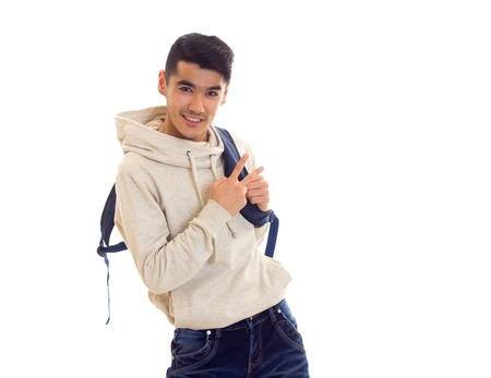 Young man with glasses and backpackの写真素材