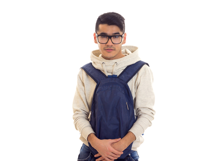 Young man with glasses and backpackの写真素材
