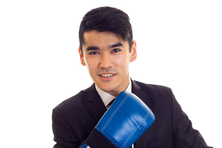 Young man in suit with boxing glovesの写真素材