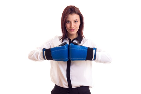 Young businesswoman in boxing glovesの写真素材