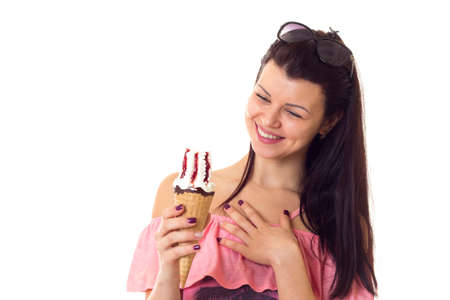 Woman in dress with sunglasses holding ice-cream