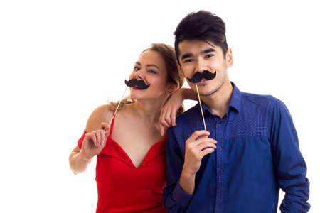Young couple with cardboard sticks