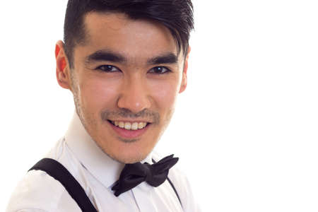 Young man with bow-tie and suspendersの写真素材