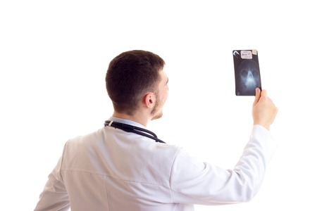 Young man in doctor gownの写真素材
