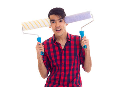 Young man holding two rolls