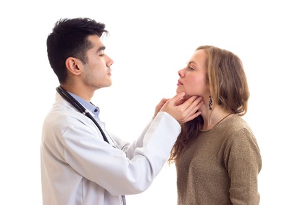 Doctor examing his patientの写真素材