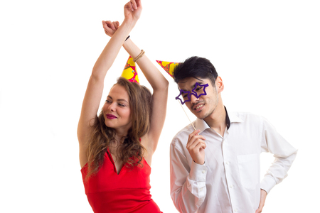 Young couple with card sticks and celebrating hatsの写真素材