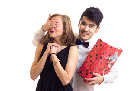Young couple holding a presentの写真素材