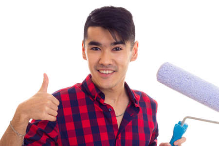 Young man holding a rollの写真素材