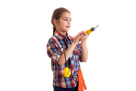 Little girl holding screwdriver and rouletteの写真素材