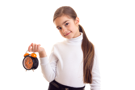 Little girl holding a clockの写真素材