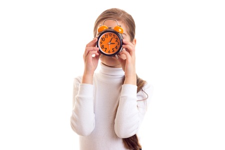 Little girl holding a clock