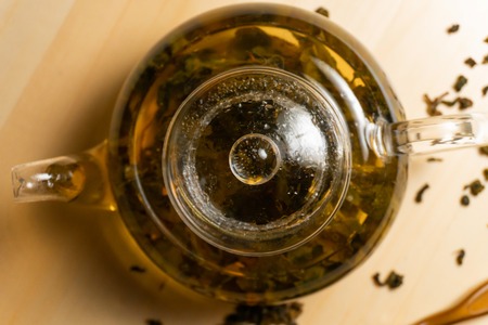 Top view on teapot with brewed chinese green teaの写真素材