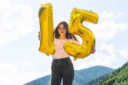 Teenage happy girl celebrating her 15th birthdayの写真素材