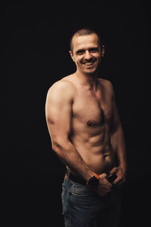 Smiling man with naked body looking in cameraの写真素材