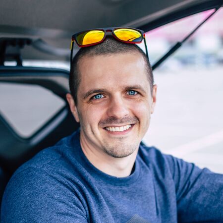 Closeup portrait of man with blue eyes looking in cameraの写真素材