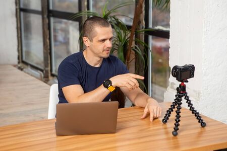 Man blogger filming new video for his channelの写真素材