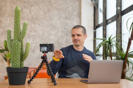 Man blogger or coach teaching people via video lessons.の写真素材