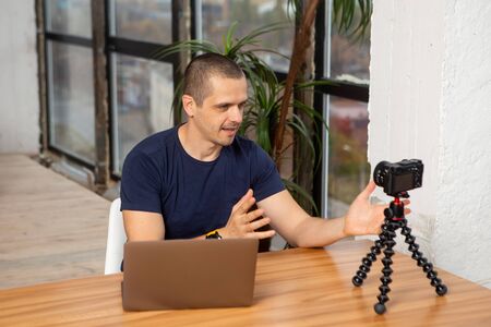 Man taking video for his video blog or channelの写真素材