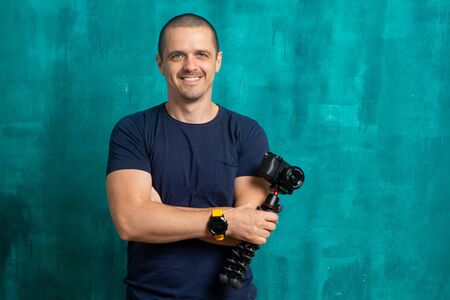 Portrait of man videographer or blogger with camera