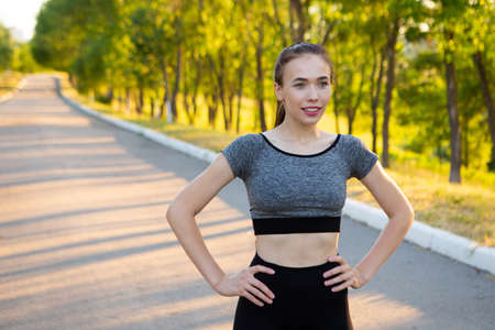 Closeup portrait of sporty athletic woman in sportswear looking in cameraの写真素材