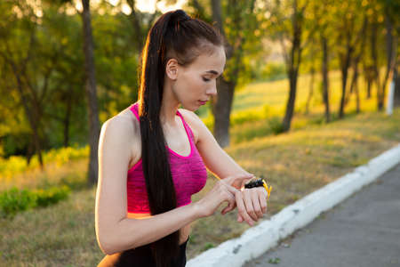 Woman checking fitness and health tracking wearable deviceの写真素材
