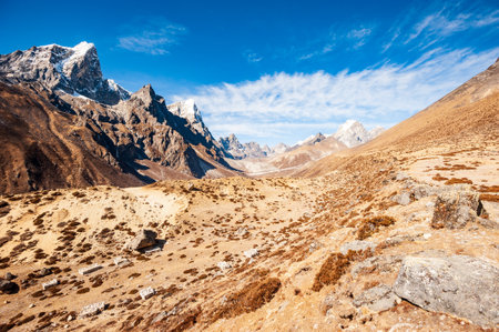 Valley leading to the Everest base camp with Tawoche / Taboche peak. Trekking in Nepal Himalayas. EBC (Everest base camp trek) trail upper part from Lukla to EBC of Everest trek. Nepal.の写真素材
