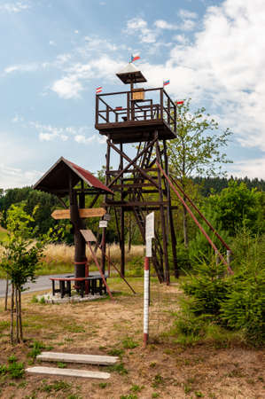 Lookout tower in small village NovÃ¡ Ves u KdynÄ, Sumava, Bohemian Forest, BÃ¶hmerwald, Czech Republic. Wooden signpost.の写真素材