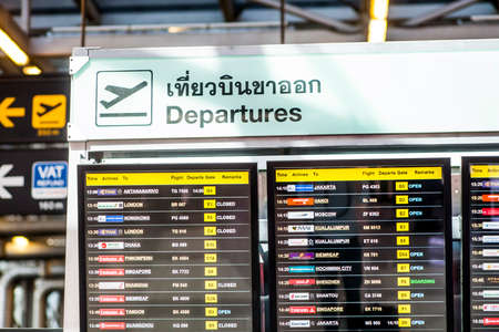 editorial - departures board inside the terminal at bangkok international airport. bangkok, thailandのeditorial素材