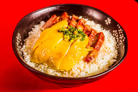 Cantonese food - hainan chicken and bbq red pork (char siu) with riceの写真素材