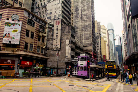 Hong Kong, China - 9 April, 2010: Double deck tram on a busy street in Sheung Wan district of Hong...