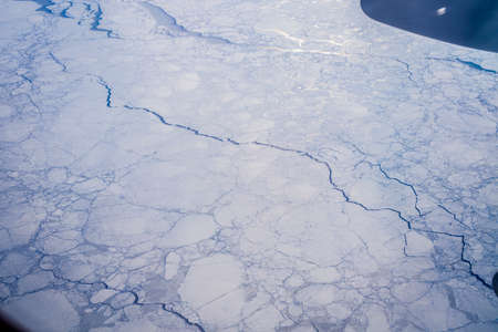 Aerial view of ice flows and snow covered landscapes