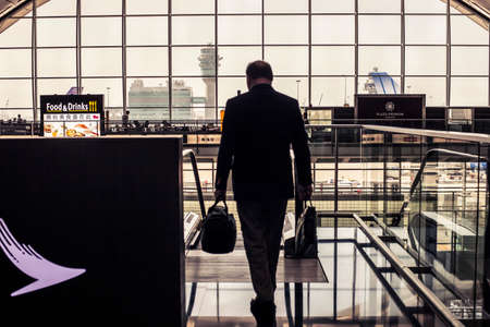 Hong Kong, China - 15 November, 2013: Passengers walking to their gates at Hong Kong International Airportのeditorial素材