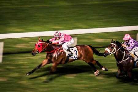 Hong Kong, China - 3 June, 2009: Horse racing at the Happy Valley Racecourse in Hong Kongのeditorial素材