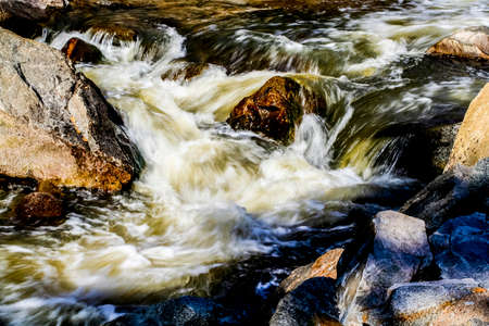 Creek in the mountains with flowing water