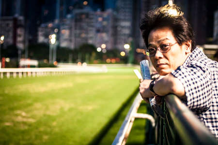 Hong Kong, China - 3 June, 2009: Horse racing at the Happy Valley Racecourse in Hong Kongのeditorial素材