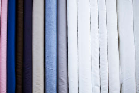 Many types of fine cloth at a bespoke tailor shop
