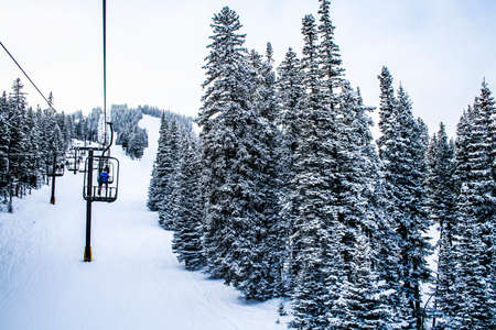 Ski lift on a mountain with snowの写真素材