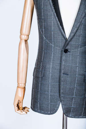 Details of a tailored suit jacket with markings on it for stitching, cutting and tailoringの写真素材