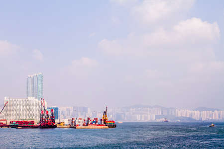 Hong Kong, China - 27 October, 2009: Skyline of the city with Victoria Harbour and a small container portのeditorial素材