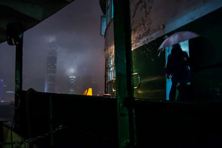 Hong Kong, China - 24 May, 2009: View from the Star Ferry crossing Victoria Harbour during a rain...
