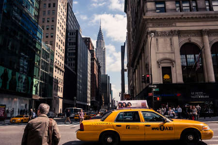 New York, USA - 23 September, 2009: Taxis driving in downtown Manhattan with a view of the Chrystler Buildingのeditorial素材
