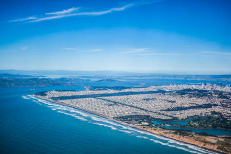 Aerial view of the city and the Golden Gate Bridge in San Franciscoの写真素材