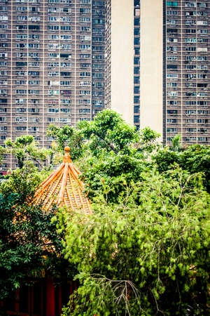 Wong Tai Sin Temple in the Diamond Hill District in Hong Kong set against a residential high rise