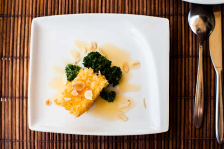 Deep fried brie cheese on a white plateの写真素材