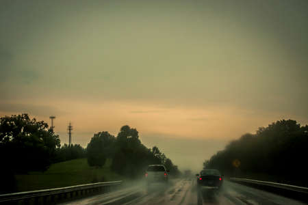 Driving through a rainstorm in rural Americaの写真素材