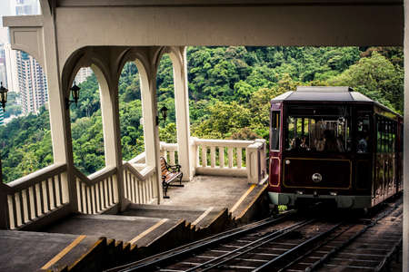 Hong Kong, China - 19 May, 2009: Tourists riding on the Peak Tram which goes from Admiralty district to victoria Peak on an overcast dayのeditorial素材