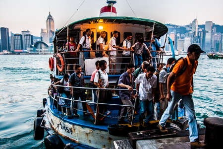 Hong Kong, China - 2 June, 2009: Passengers on a ferry at Victoria Harbour, crossing between Kowloon and the Islandのeditorial素材