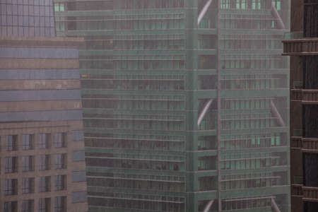 Heavy rain in the downtown district of a large cityの写真素材